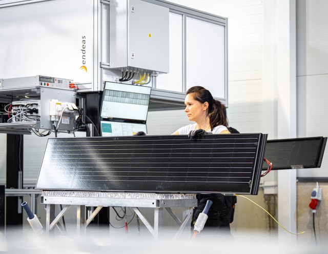 Solarstone factory employee testing a BIPV solar panel